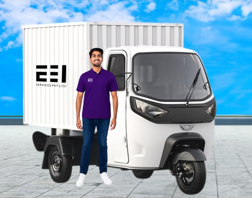 EEI franchise partner standing next to an electric delivery three-wheeler